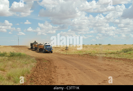 Road train on dust road near Carisbrooke Station in Outback Queensland, Australia Stock Photo