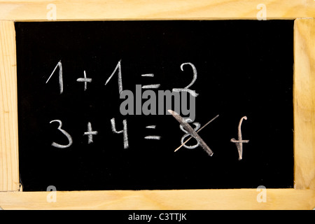 an error in the calculation on a chalkboard Stock Photo