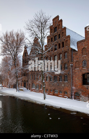 Salzspeicher, historic salt warehouses / salt storehouses in the snow in winter, Hanseatic city, Lübeck, Germany Stock Photo