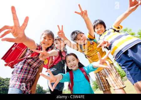 Five Schoolchildren Doing Peace Sign Stock Photo