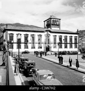 Historical picture from Madeira taken 1950s by J  Allan Cash. Cars and people outside Praca do Municipio building at Funchal. Stock Photo