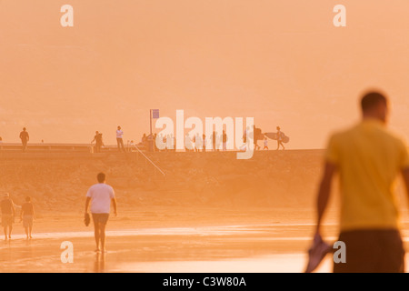People on the beach and jetty at Las Canteras Beach in Las Palmas de Gran canaria. Stock Photo