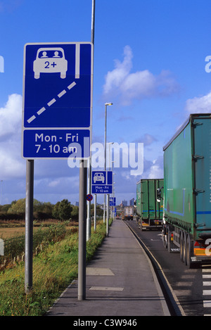 lorry passing warning roadsign of high occupancy lane ahead for vehicles carrying two or more people to ease congestion Leeds UK Stock Photo