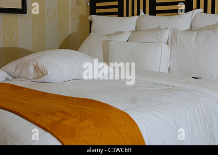 Modern Hotel Room with candy on the pillow Stock Photo