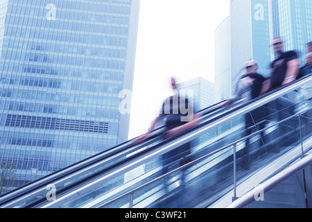 City travelers on escalator,motion blur. Stock Photo