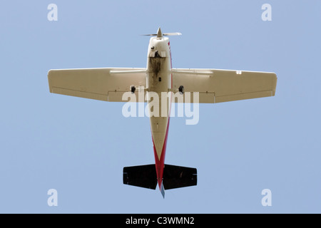 Little propeller airplane ( Cessna  ) low pass, seen below. Stock Photo