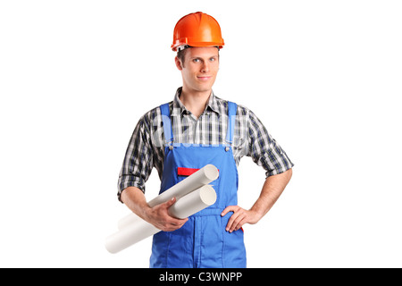 A construction worker wearing helmet and holding blueprints Stock Photo