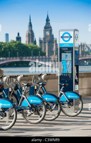 Bicycles for hire as part of the Transport for London Cycle HIre scheme on the south bank of the River Thames, London, England. Stock Photo