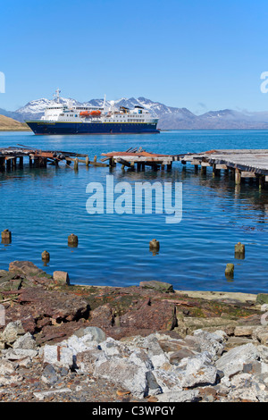 The National Geographic Explorer anchored in Grytviken, South Georgia, in front of the derelict pier Stock Photo