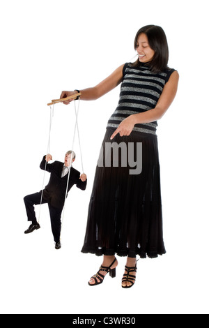 Young employee with her boss on strings Stock Photo