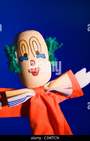 A traditional handmade wooden toy clown. Stock Photo