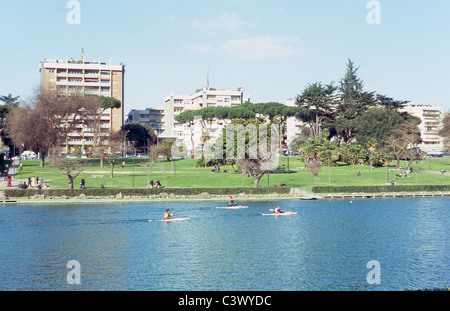 Artificial lake and Central Park in the EUR district, with luxury apartment buildings in the background, Rome, Italy Stock Photo