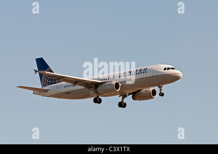 An Airbus A320 jet airliner belonging to United Continental Holdings, inc and painted in the airlines new UNITED livery. Stock Photo