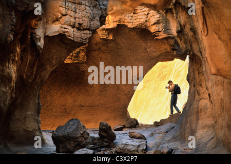 Algeria, Djanet. National Park Tassili n'Ajjer. UNESCO World Heritage site. Tourist making video/film. Sahara desert. Stock Photo