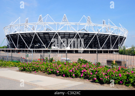 Flowers planted Greenway footpath & bike cycling route embankment above Joseph Bazalgette Northern Outfall Sewer 2012 Olympic stadium East London UK Stock Photo