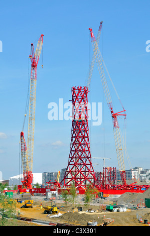 Construction cranes erecting central structural core of steel on ArcelorMittal Orbit tower for London 2012 Olympics Stratford Newham East London UK Stock Photo