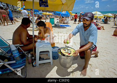 Brazil, Recife, Selling oysters on the beach. Stock Photo