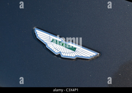 Aston Martin badge on bonnet of car Stock Photo