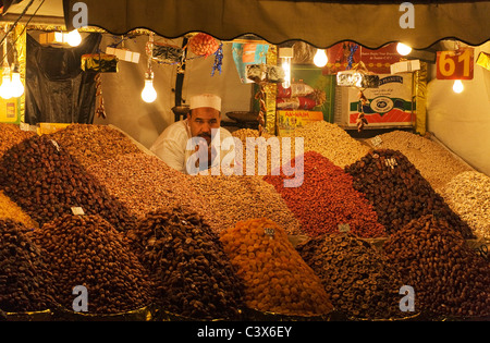 Dried fruit and nut vendor on the Djemaa el Fna market place. Marrakesh, Morocco Stock Photo
