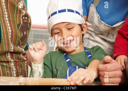 Young boy having fun in kitchen Stock Photo