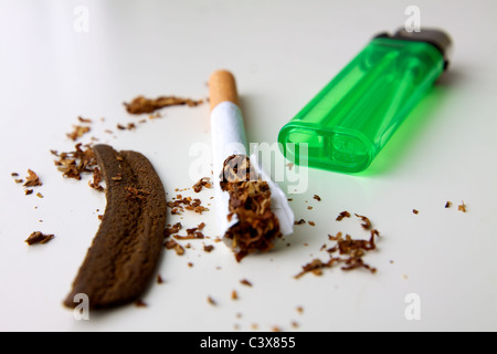 Moroccan hashish or hash, a cigarette, tobacco and a lighter to light the joint Stock Photo
