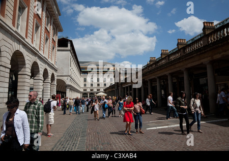 Shoppers in Covent Garden Piazza, London Stock Photo