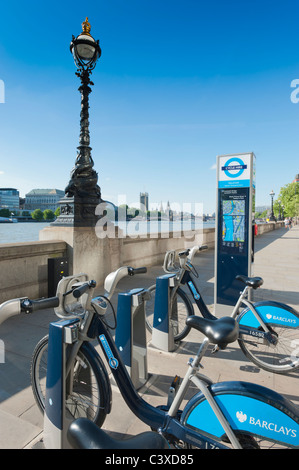 Bicycles for hire as part of the Transport for London Cycle HIre scheme on the south bank of the River Thames, London, England. Stock Photo