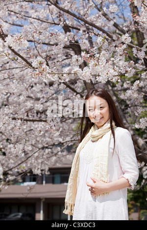 Portrait of a young woman with cherry blossoms Stock Photo - Alamy