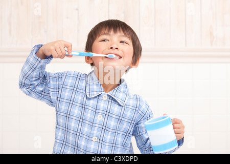 Boy Brushing Teeth Stock Photo