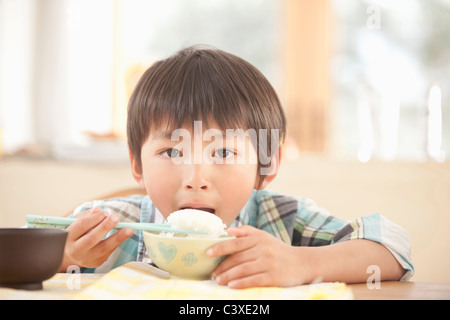 Boy Eating Rice Stock Photo