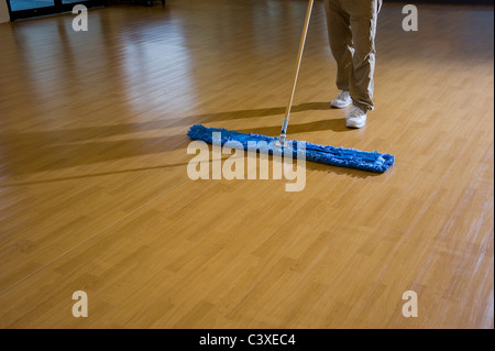 Man Cleaning Wood Floor Stock Photo