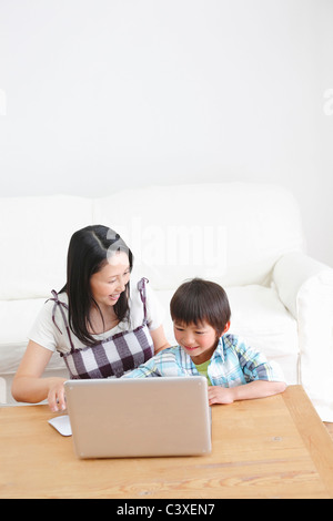 Mother and Son Using Laptop Stock Photo