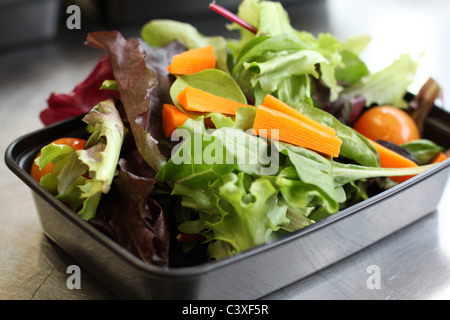 A close up of a nutritious salad in a plastic to-go container. Stock Photo