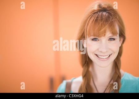 Red haired woman smiling Stock Photo
