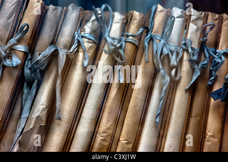 Old anuscripts, tied and shelved, at the University in Wroclaw, a city in the Silesia region of Poland. Stock Photo