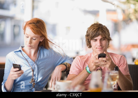 Man and woman writing sms Stock Photo