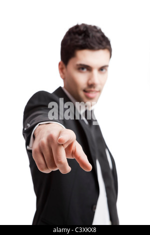 Young businessman pointing to you, isolated over a white background Stock Photo