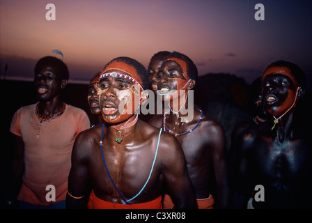El Molo Warriors and tribal people dance during the Hippopotamus Ceremony. Lake Turkana - Kenya. Stock Photo