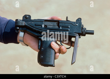 Uziel Gal, the designer and namesake of the Uzi submachine gun, holding a micro-uzi pistol. Israel Stock Photo