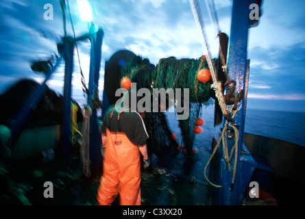 Fishermen hauls in dragger fishing net. Stellwagon Bank, New England, Atlantic Ocean. Stock Photo