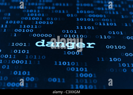 Concept of danger word on binary data background Stock Photo