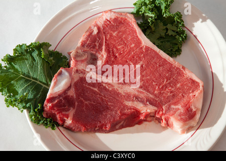 Raw T-bone steak on a platter USA Stock Photo