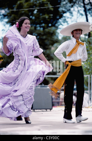 Hispanic teen age dancers perform mexican spanish flolk dances at festival in Santa Fe New Mexico, USA Stock Photo