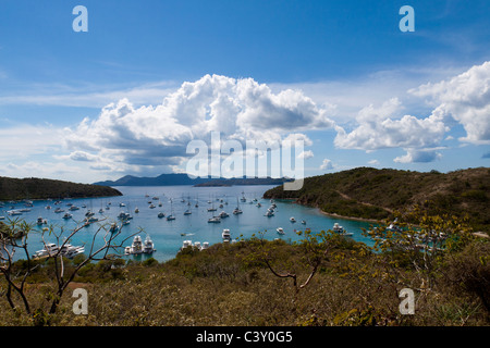 View of many boats moored in The Bight Bay from overlook on Norman Island in British Virgin Islands Stock Photo