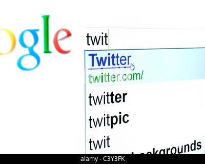 User is trying to find a twitter website by the Google search engine ... Stock Photo