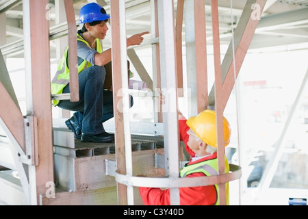Female architect talking to a builder Stock Photo