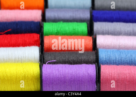 lot of colored thread spools - background Stock Photo - Alamy