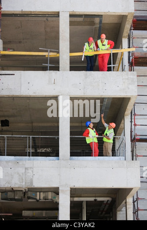 Building workers in a shell of building Stock Photo