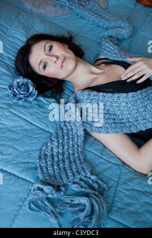 Woman laying on bed dreaming Stock Photo