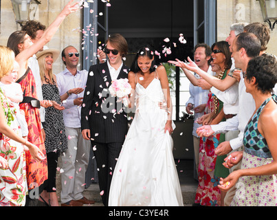 Freshly married couple leaving church Stock Photo